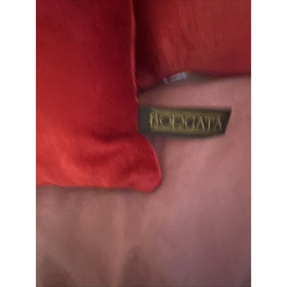 Borgata red velvet throw pillow gold-toned vintage brooch pinned to the center